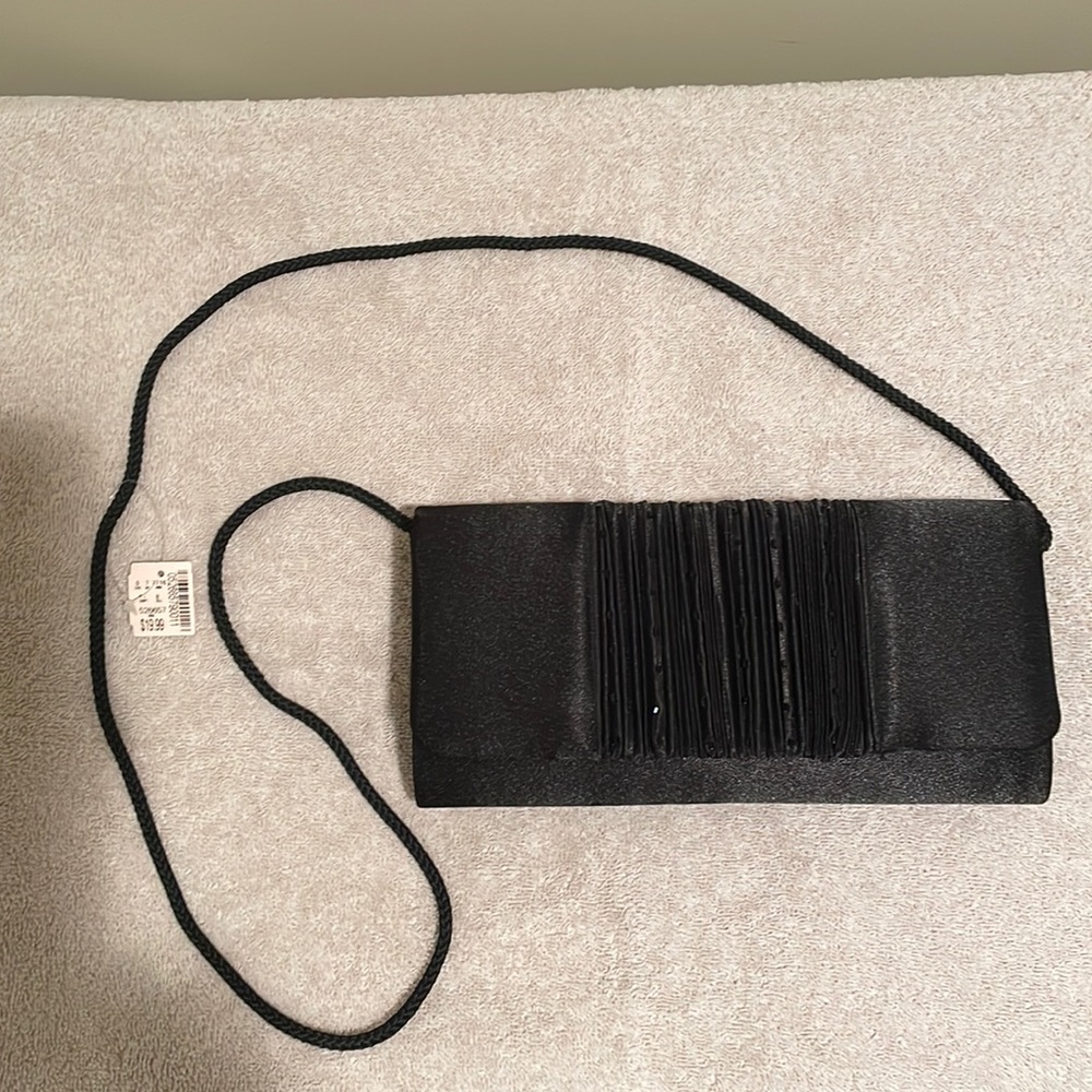 Black with small black sequins beads clutch with rope strap.